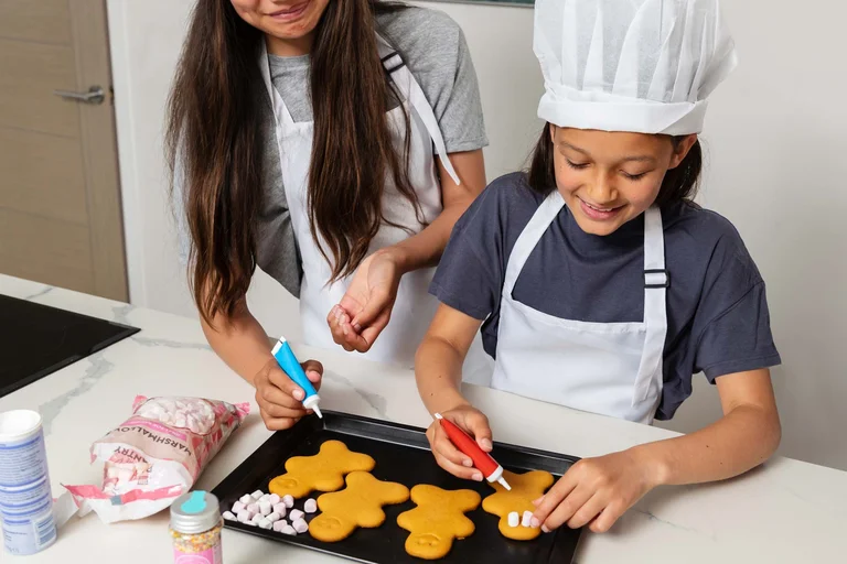 Mini Bakers activity with students preparing food